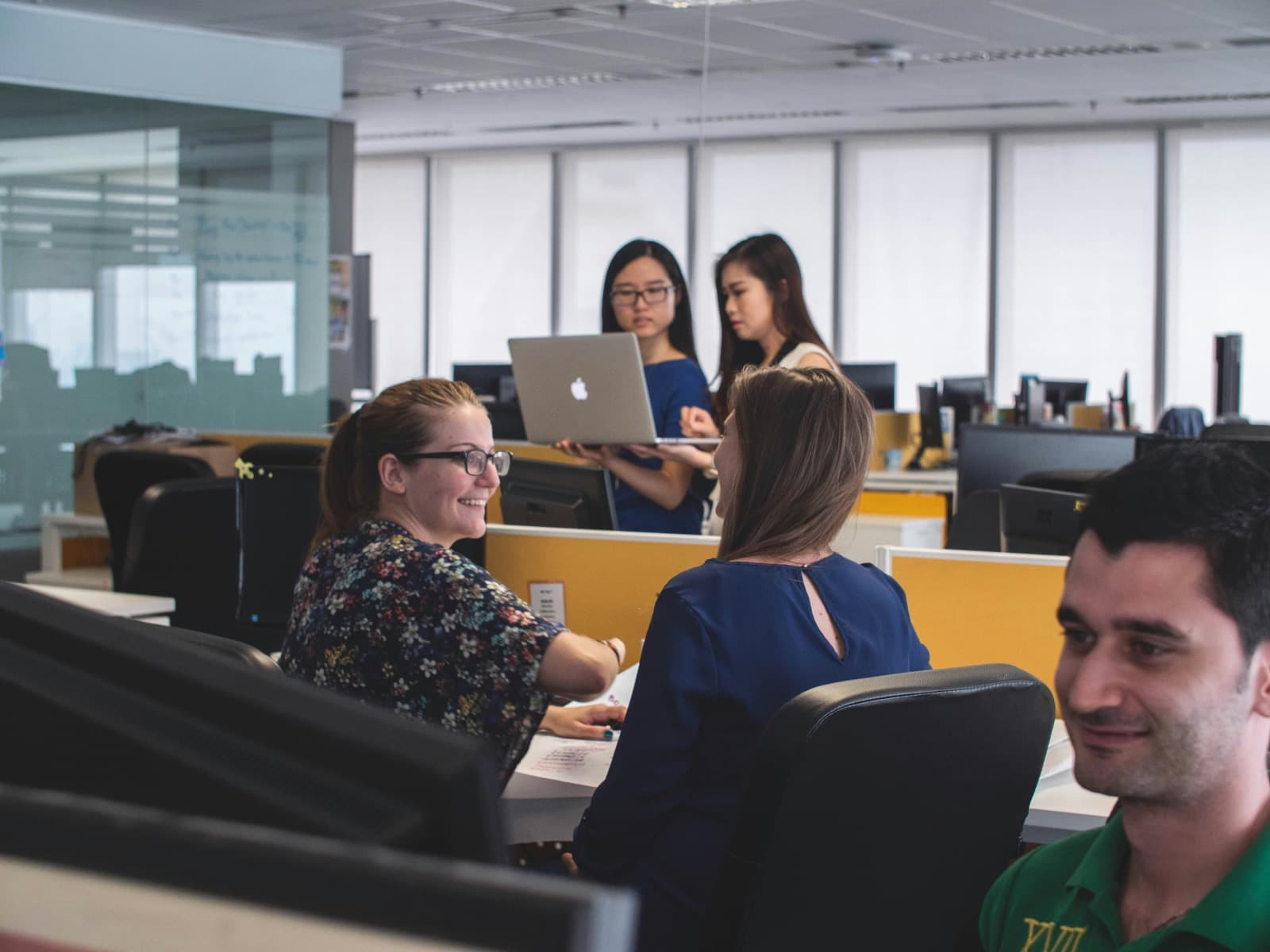 A working studio floor — desks, screens, and conversation