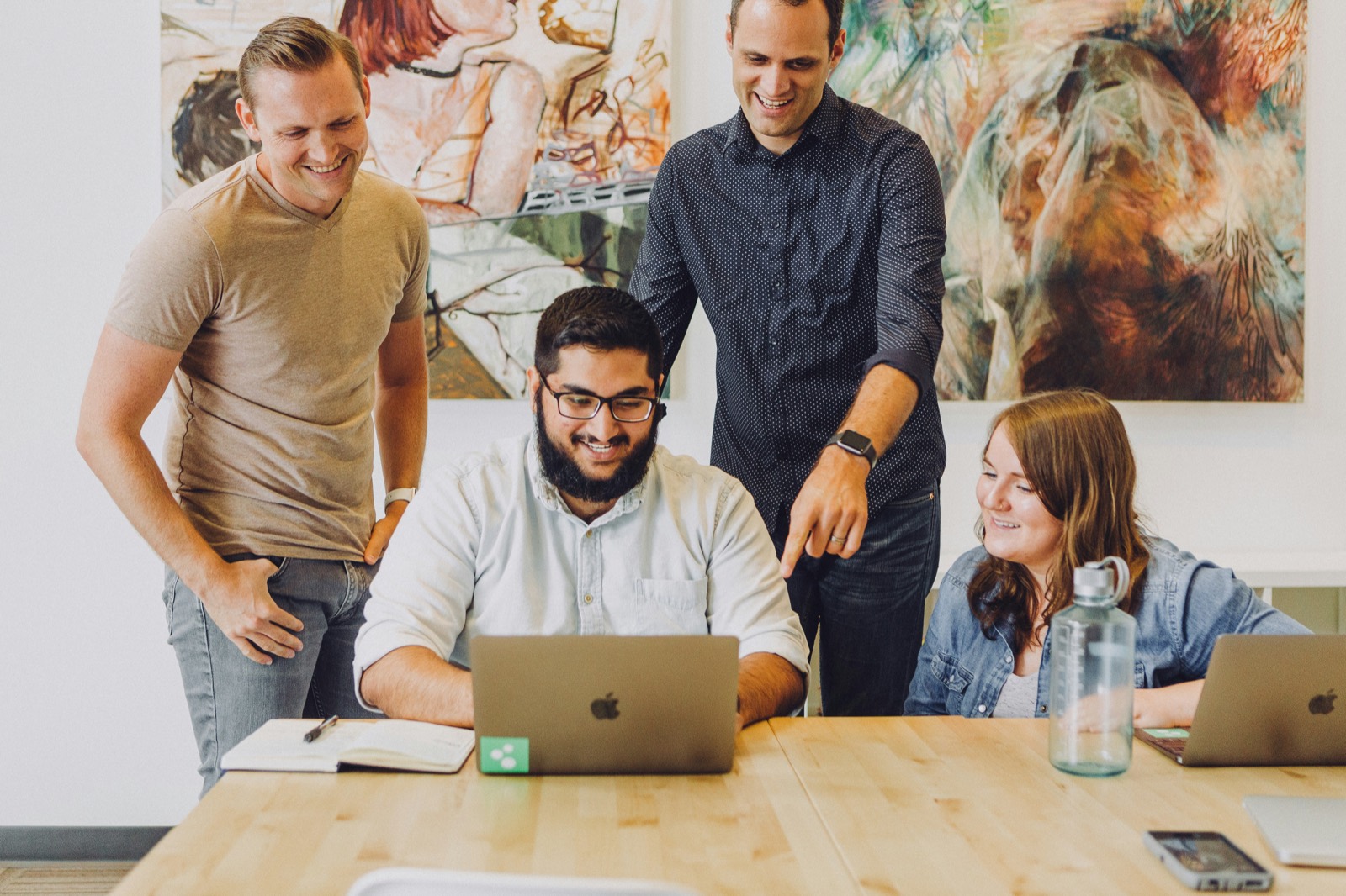 Small team around a laptop